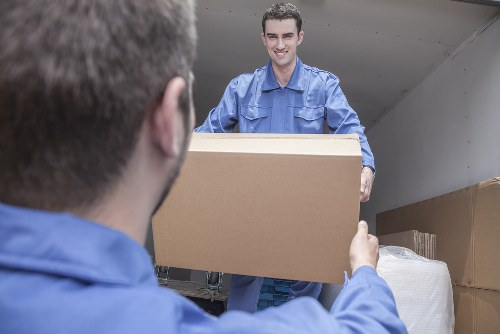 Furniture removals team handling a sofa move in Balham