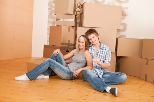 Local commercial movers handling desks and boxes carefully
