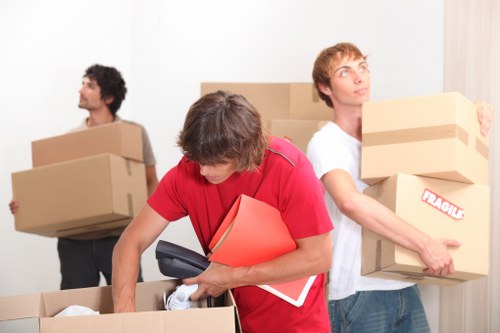 Preparing office items for a move with labels and packing materials